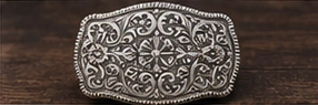 Engraved silver oval buckle design study.