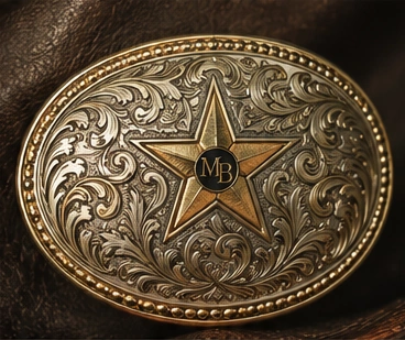 Silver-and-gold Texas star buckle design study, photographed on dark leather.